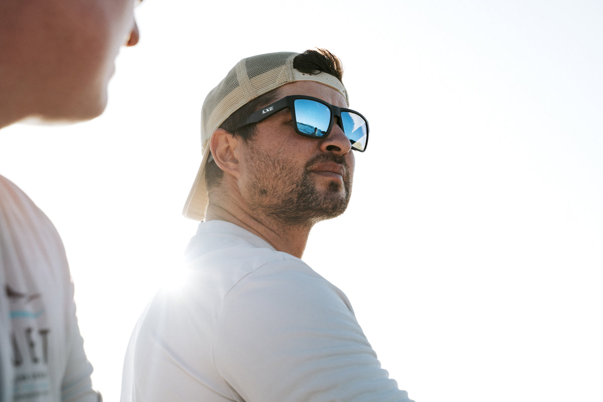 LXD team angler on the water, blue mirror lens